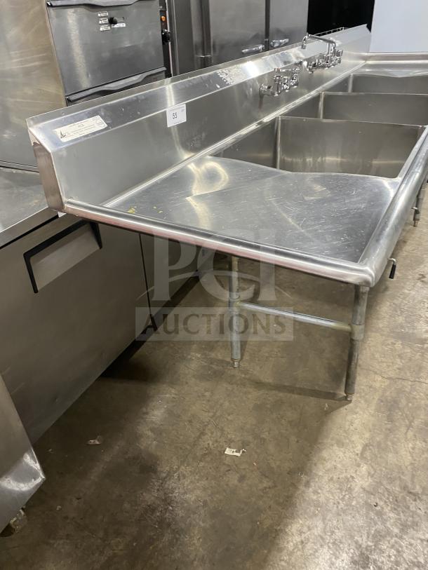 KCS commercial stainless steel 3-compartment sink on legs. Features sturdy construction, multiple faucets. Ideal for kitchens.