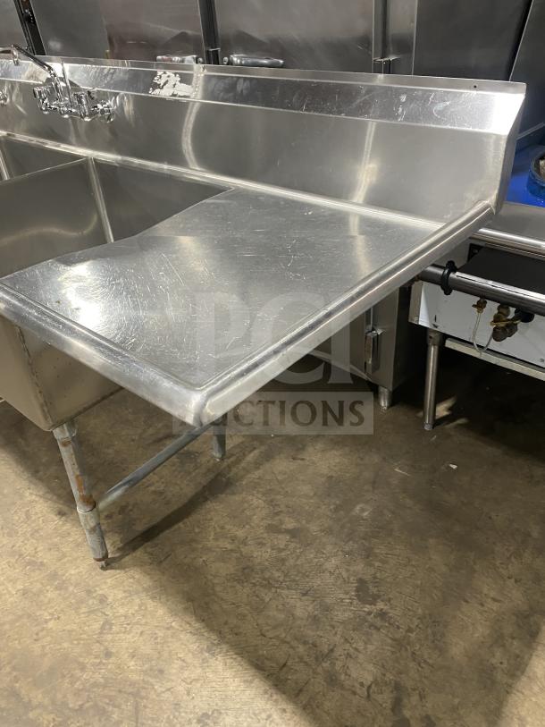 KCS commercial stainless steel 3-compartment sink on legs, gently used. Features sturdy legs and integrated backsplash.