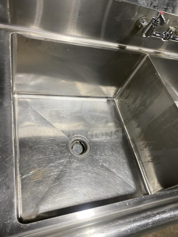 KCS commercial stainless steel 3-compartment sink with drain, on legs, light wear, ideal for restaurant use.