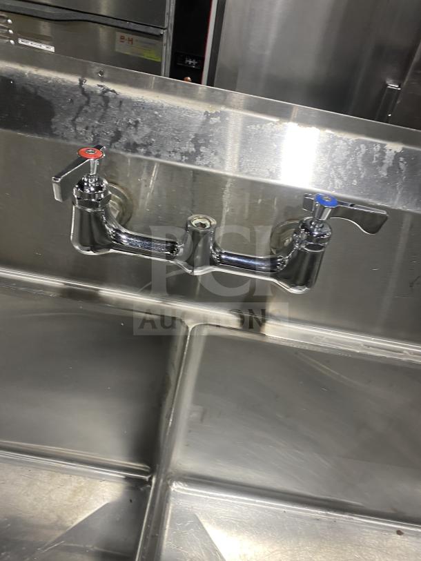 KCS commercial stainless steel 3-compartment sink on legs. Features hot and cold faucets, suitable for commercial use.