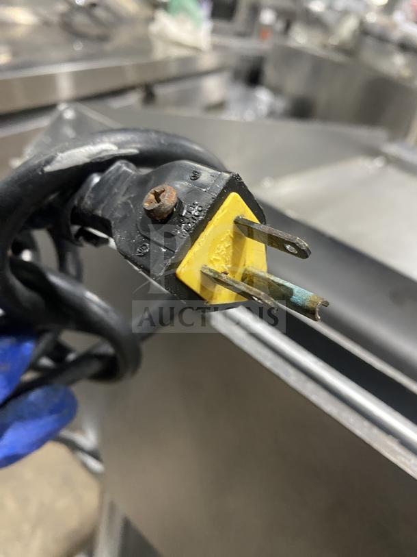 Vulcan Checkers Style commercial griddle; stainless steel, natural gas, back & side splash, undershelf cart, on casters.