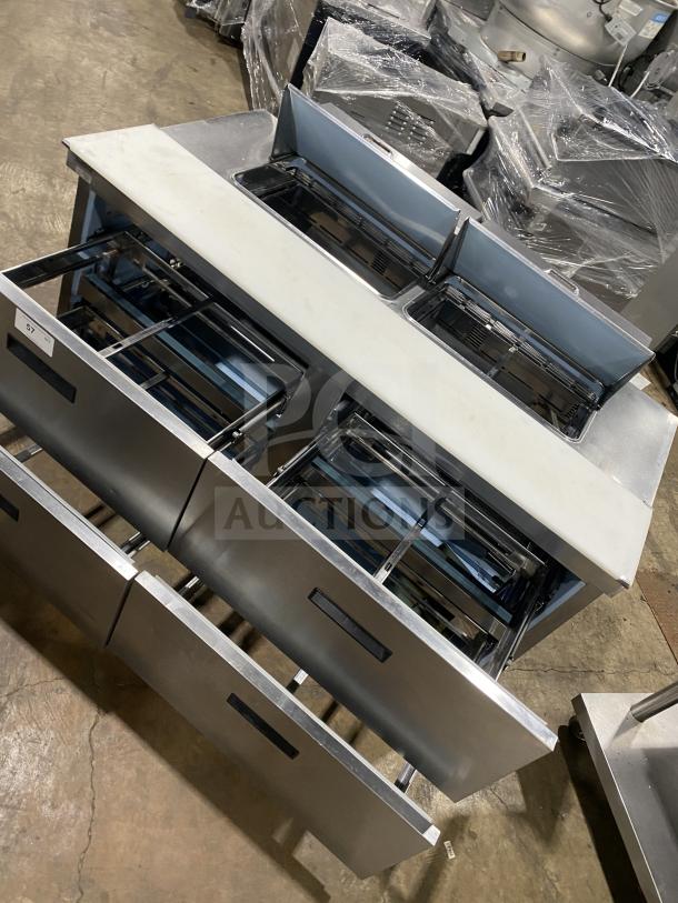 Delfield Manitowoc stainless steel 4-drawer mega top refrigerated prep table, Model UCD4464N-12-DD5, in good condition.