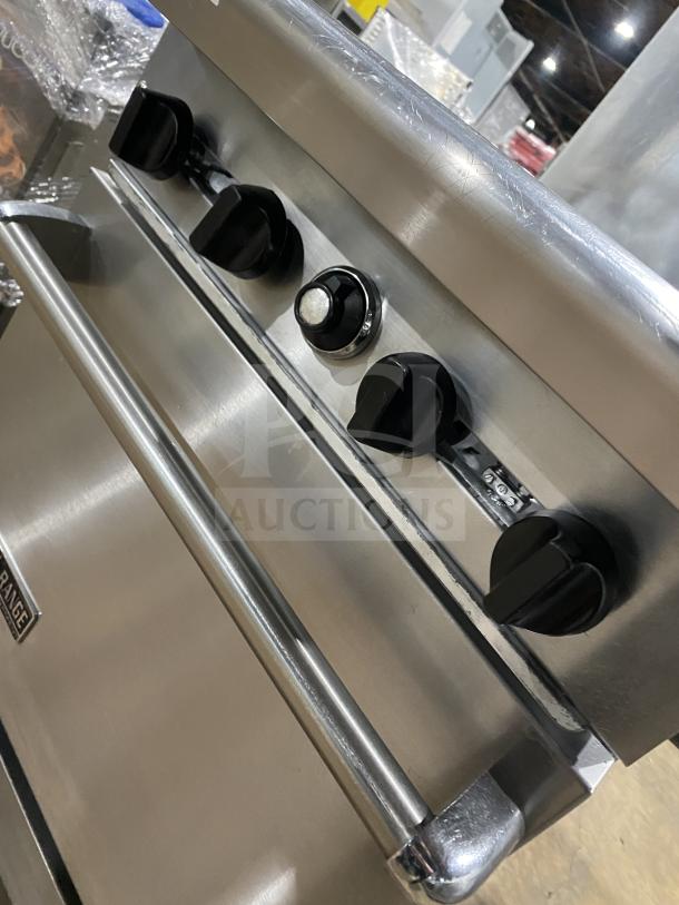 American Range stainless steel 4-burner gas oven combo with backsplash, overhead salamander shelf, wired rack, and casters.