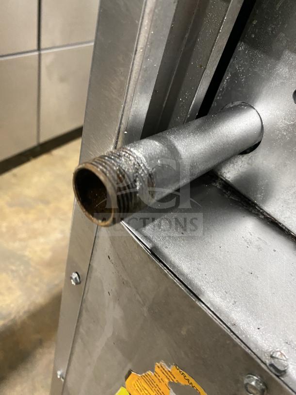 American Range stainless steel 4-burner gas range/oven combo with backsplash, overhead salamander shelf, and casters.