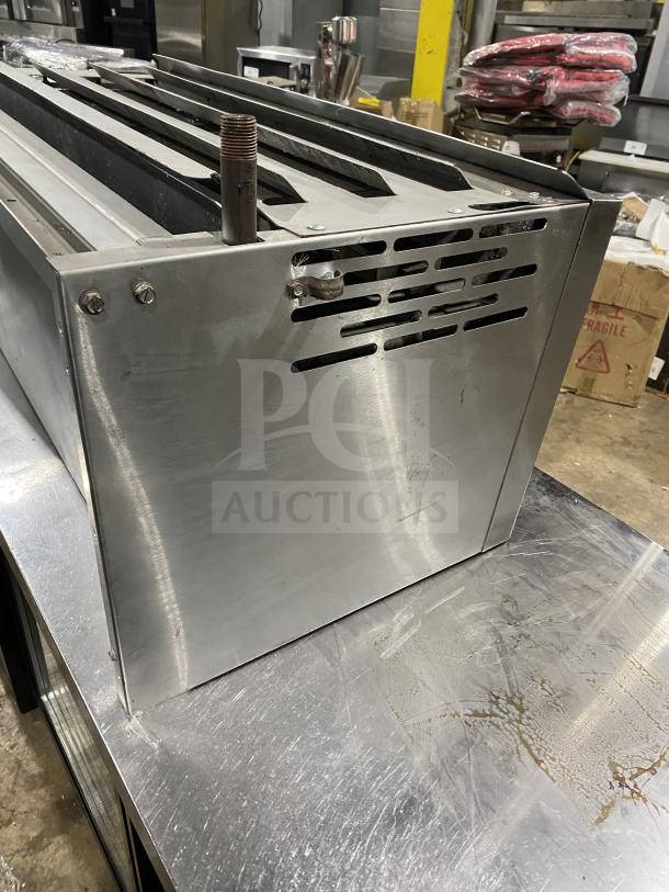 American Range stainless steel salamander broiler in good condition, featuring sturdy construction and commercial-grade design.