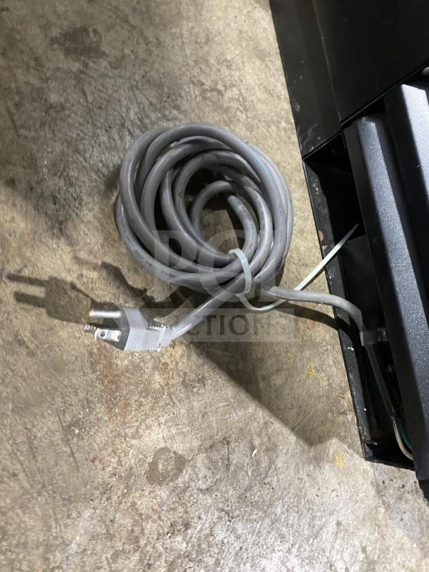 Turbo Air TBB-2SB 2-Door Bar Back Cooler, black with stainless steel worktop, poly coated rack, on casters, with power cord.