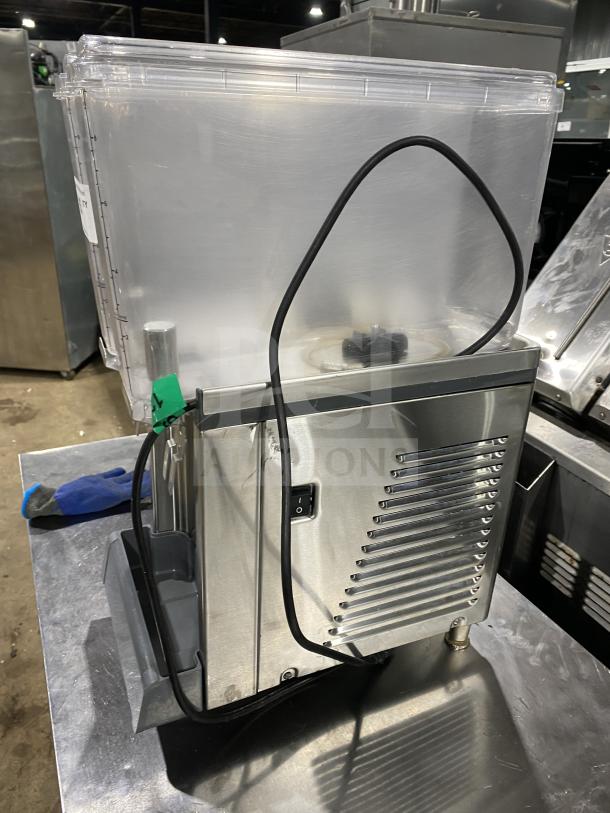 Crathco CS2E1D16 stainless steel refrigerated beverage dispenser with clear hoppers, double drip trays, 115V, on legs.