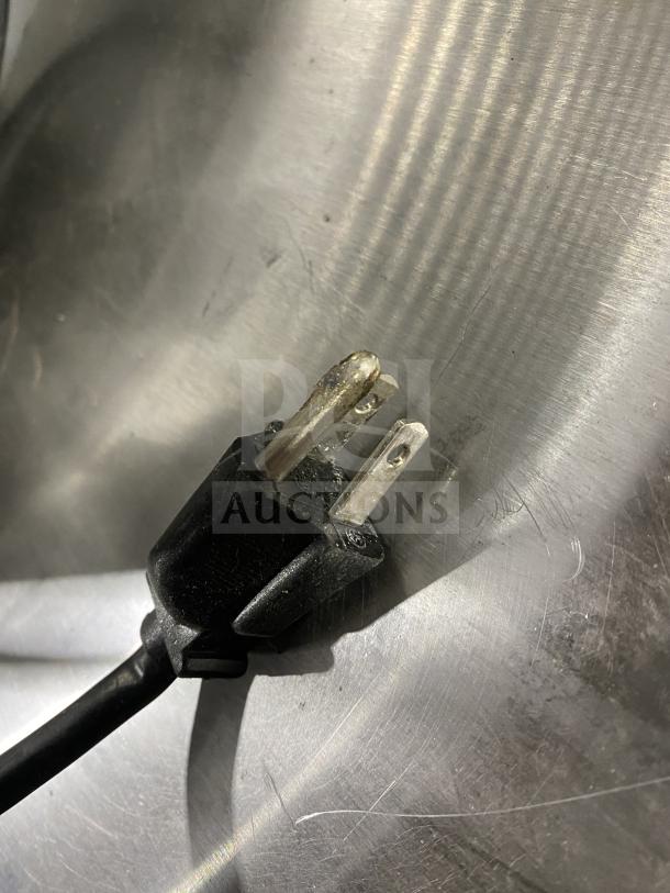 Close-up of a power plug for the Crathco Classic Bubbler Series CS-2E/1D-16 beverage dispenser.