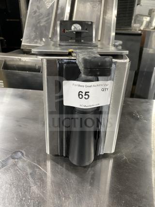 Commercial food warmer with a control knob and indicator light. Auction tag 65 by PCIAuctions.com attached.