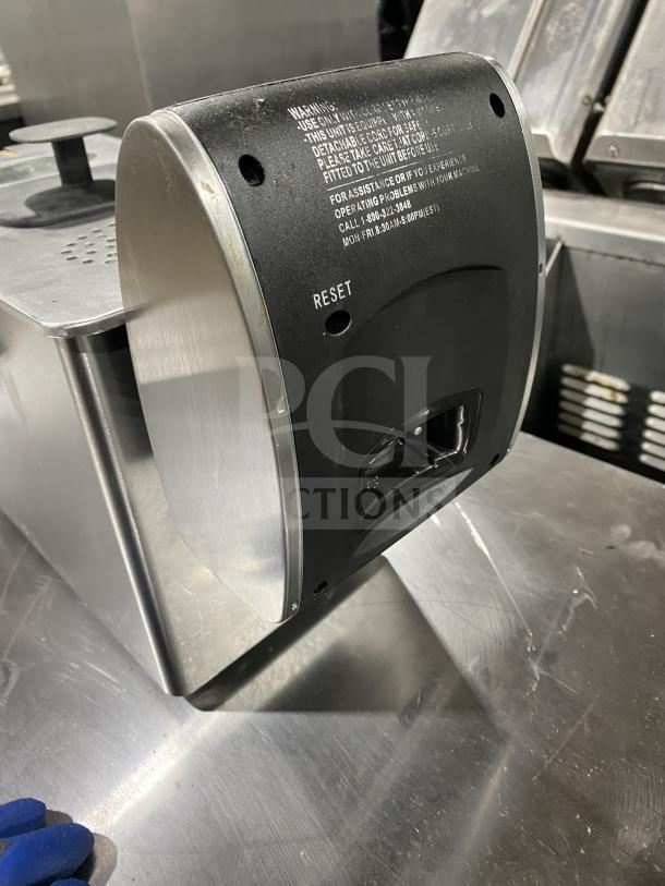 Stainless steel commercial kitchen appliance with black panel and "RESET" label. Good condition, shows light surface wear.