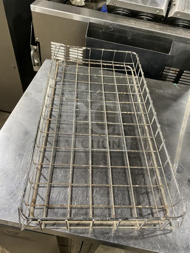 Stainless steel commercial bagel wrap tray, grid design, used condition, sturdy construction, ideal for bakery use.