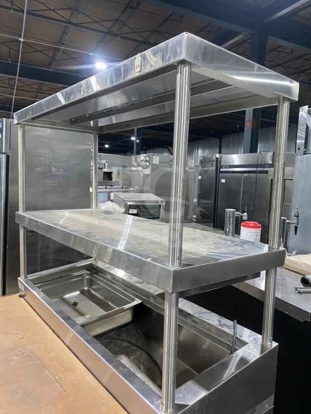 Delfield stainless steel refrigerated salad prep table with 1 door, mega top, and enclosed storage. Good condition.