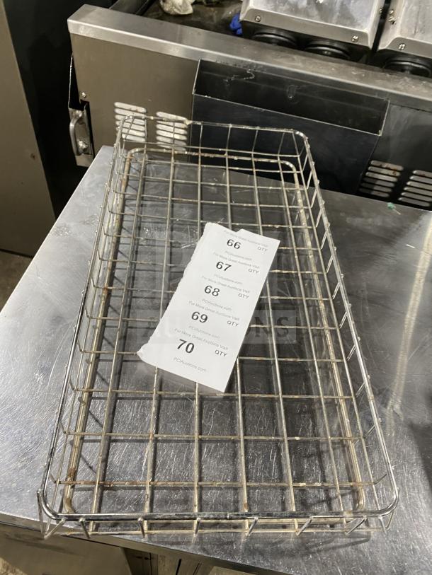 Stainless steel wire basket for commercial use, suitable for bagel wraps. Visible stickers with auction info. Appears used.