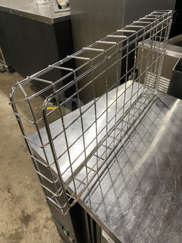 Stainless steel commercial bagel wrap, wire mesh design, excellent condition, durable construction, ideal for bakery use.