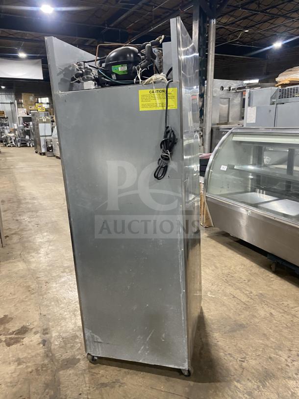 Hoshizaki stainless steel reach-in merchandiser refrigerator, model CR1B-FGYCR, shown from the side with exposed compressor, on casters.