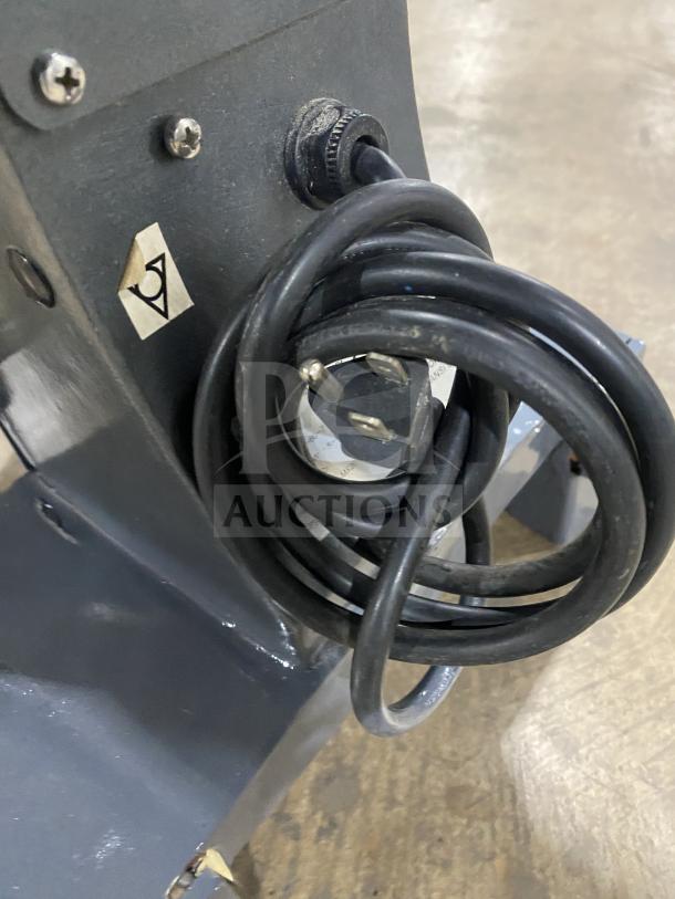 Avantco MX20 commercial mixer cord detail, showing power plug and connection. Serial number visible on label.