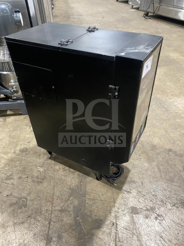 Bunn FMD DBC-3 commercial dispenser on legs, black, single hopper, 120V, for cappuccino/espresso/hot chocolate. Good condition.