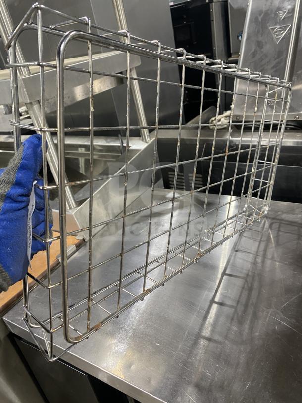 Stainless steel bagel wrap rack, commercial-grade, open wire design, sturdy construction, gently used condition.