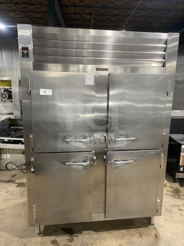 Traulsen stainless steel 4-door reach-in refrigerator, Model RHT232WUTHHS, with built-in pan racks, 115V, on legs.