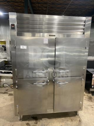 Traulsen stainless steel 4-door reach-in refrigerator, Model RHT232WUTHHS, with built-in pan racks, 115V, on legs.