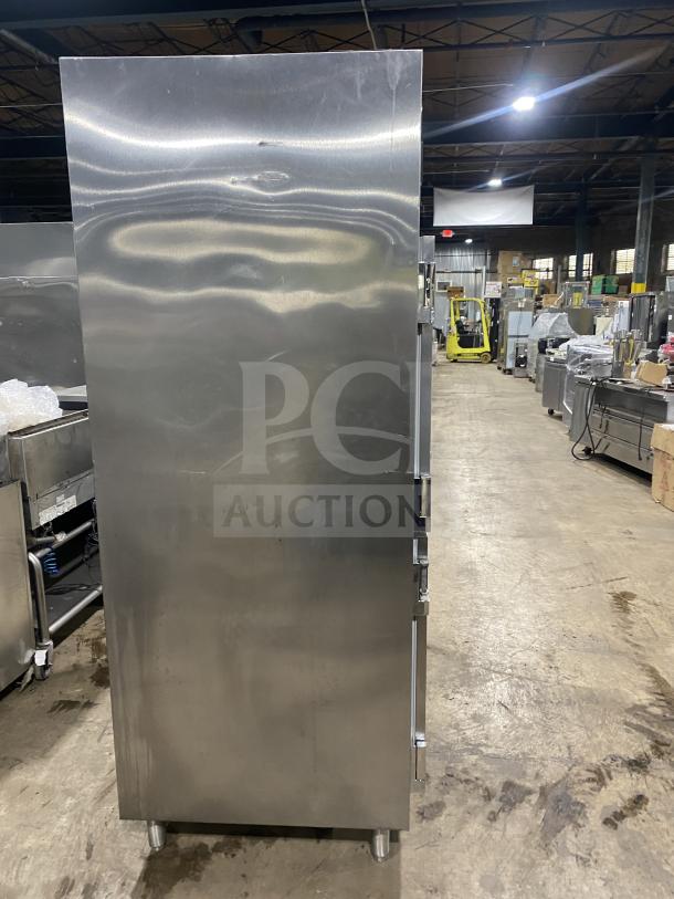 Traulsen stainless steel commercial refrigerator, model RHT232WUT-HHS, featuring four split doors and built-in pan racks.