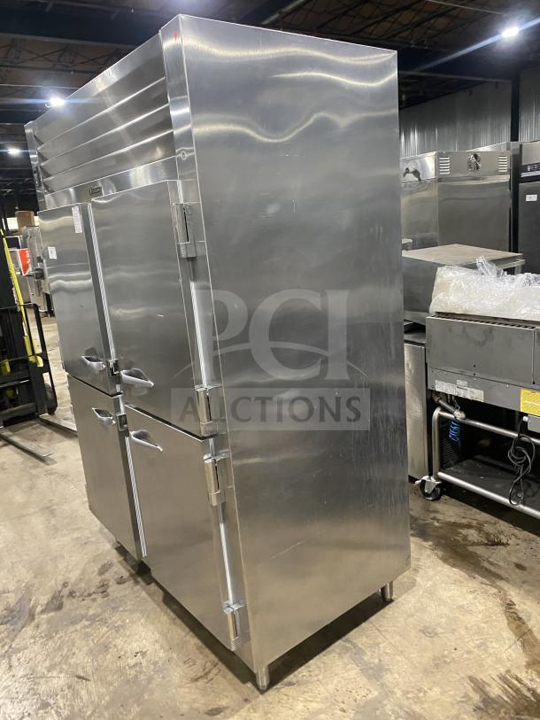 Traulsen stainless steel 4-door refrigerator, model RHT232WUT-HHS, with built-in pan racks, on legs, in good condition.