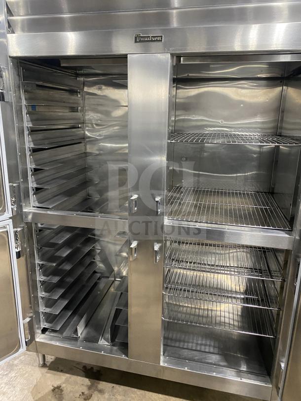 Traulsen stainless steel 4 split door refrigerator, model RHT232WUTHHS, with built-in pan racks and wire shelves, on legs.