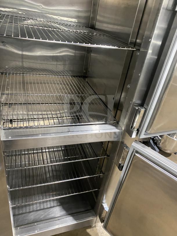 Traulsen RHT232WUTHHS stainless steel 4-door refrigerator with built-in pan racks and legs; electric, 115V, 1 phase.