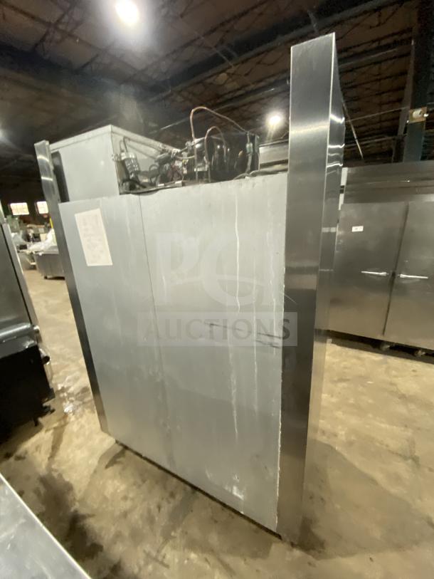 Traulsen RHT232WUTHHS stainless steel 4-door commercial refrigerator with built-in pan racks, 115V, 1 phase, on legs.