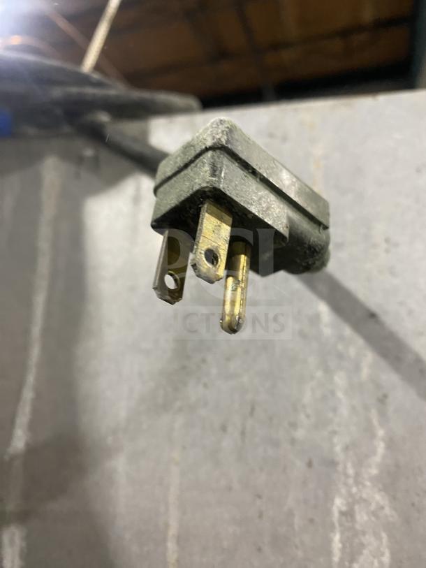 Close-up of a power plug for a Traulsen RHT232WUTHHS refrigerator. The plug is for a 115V, 1-phase connection.