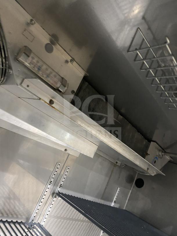 Perlick BS2DP stainless steel double glass door back bar refrigerator, black finish, with interior rack and 115V power.