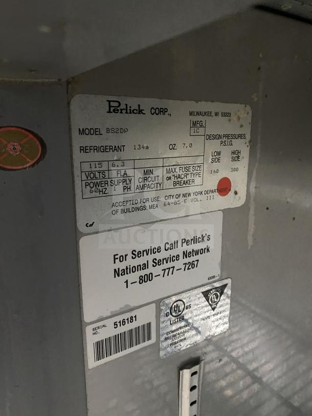 Perlick BS2DP commercial stainless steel countertop refrigerator with black double glass doors and rack, SN: 516181, 115V.