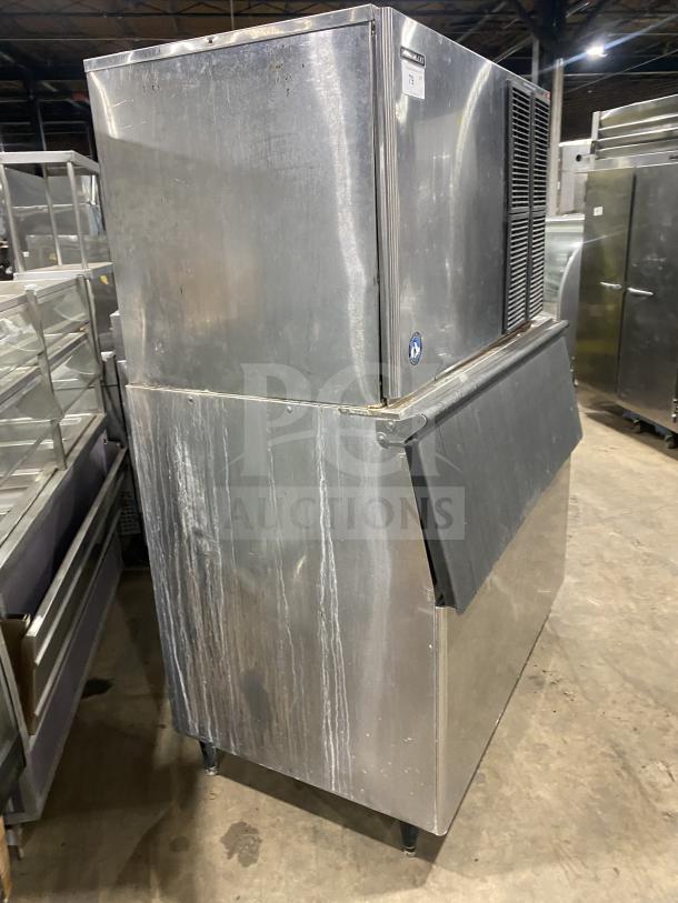 Hoshizaki KM-1301SAH3 commercial stainless steel ice machine with bin, air-cooled, on legs, model SN: C00446J.