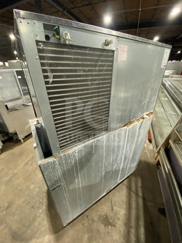 Hoshizaki KM-1301SAH3 ice machine, commercial-grade, stainless steel, air-cooled, on legs. Signs of wear, 108-230V.