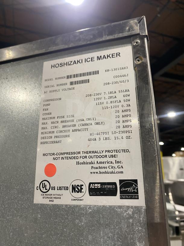 Hoshizaki KM1301SAH3 Ice Maker, stainless steel, model KM-1301SAH3, SN C00446J, air-cooled, commercial use, on legs.
