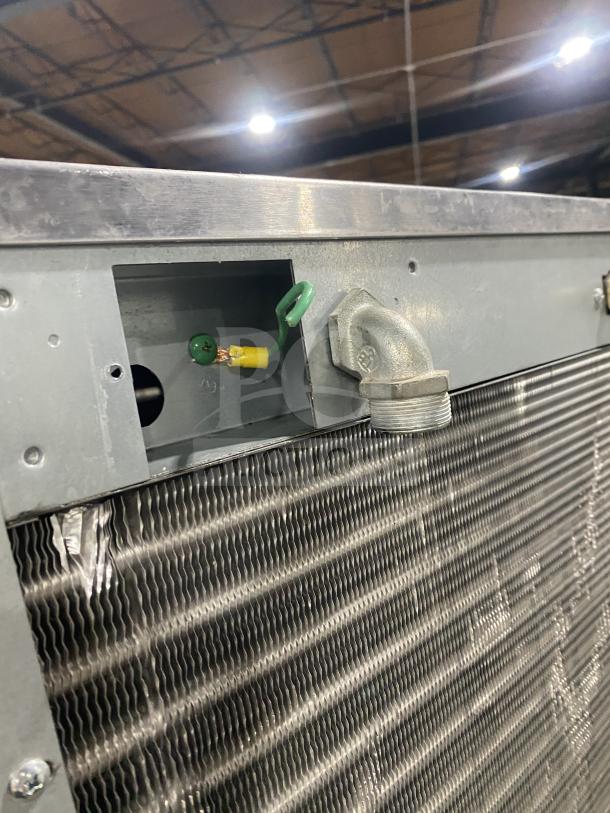 Hoshizaki KM-1301SAH3 stainless steel ice making machine showing air-cooled coil. Rugged design, model KM1301SAH3.