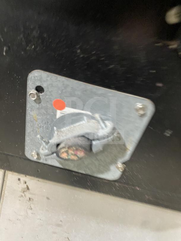 Electrical connection panel for Garland TE4CH oven, showing wired setup with colored cables and metallic mounting panel.