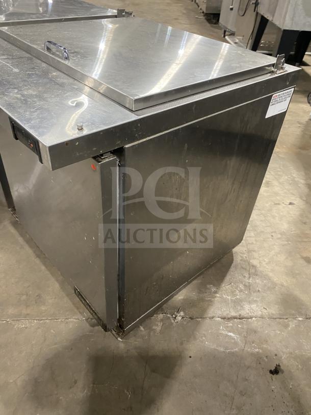 Continental stainless steel 2-door refrigerated prep table, model SW601N24M. Features poly coated wired rack, on casters.