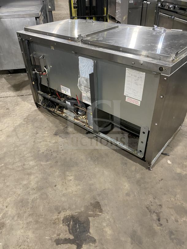 Continental stainless steel 2-door prep table, model SW601N24M, on casters. Features poly coated wired rack.