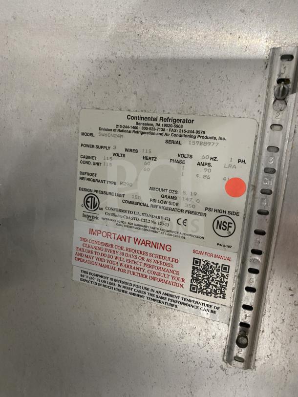 Continental Stainless Steel Refrigerated Prep Table, Model SW601N24M, 2-door, 2-section, on casters. Features poly coated wired rack. Serial: 159B8977.
