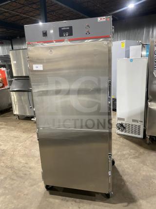 Carter-Hoffman stainless steel 2-door heated holding cabinet, model 27080-2129, on casters, 240V. Serial number 318990.