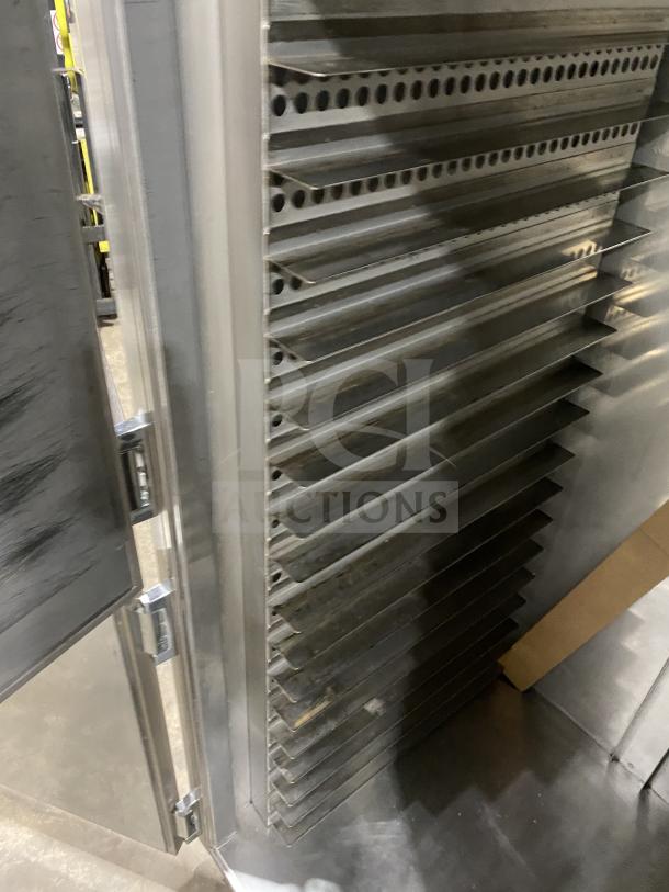 Carter-Hoffman stainless steel 2-door heated holding cabinet, Model 27080-2129, with sheet pans, on casters, in good condition.