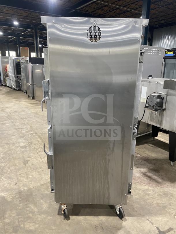 Winston Industries Cvap-4000A Series heated holding cabinet, stainless steel, half door, pass-through, model HA4522GE, on casters.