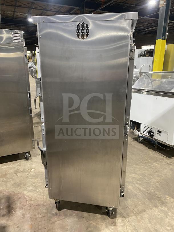 Winston Industries Cvap-4000A heated holding cabinet, stainless steel, half door, pass-through, model HA4522GE, on casters.