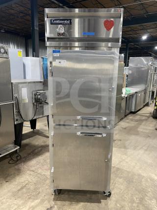Commercial stainless steel 2-door Dutch style refrigerator by Continental, Model 1RE-HD. Features rack, shelf, on casters, 115V.