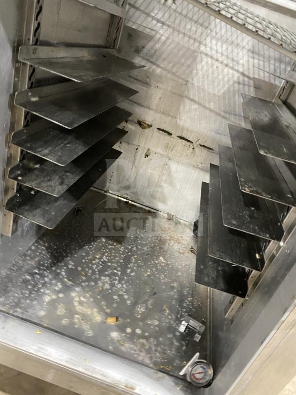 Continental 1REHD stainless steel 2-door reach-in refrigerator, with rack and shelf, visible wear, on casters. Model: 1RE-HD, SN: 15051798.