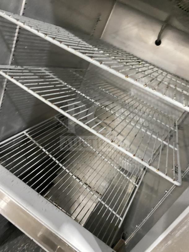 Continental Commercial 2-Door Stainless Steel Refrigerator, Model 1REHD, features interior racks and shelves, 115V, on casters.