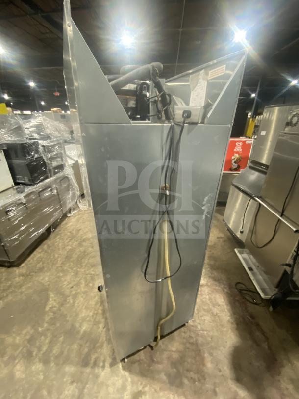 Continental 1REHD stainless steel 2-door reach-in refrigerator, on casters, featuring a rack and shelf, model 1RE-HD, SN 15051798.