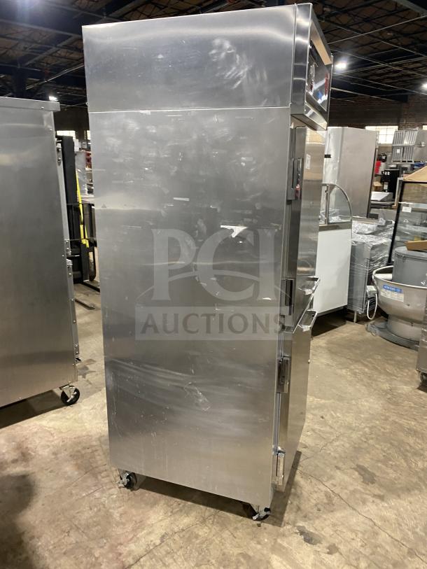 Continental 1REHD stainless steel 2-door refrigerator, model 1RE-HD, on casters. Good condition, includes rack & shelf.