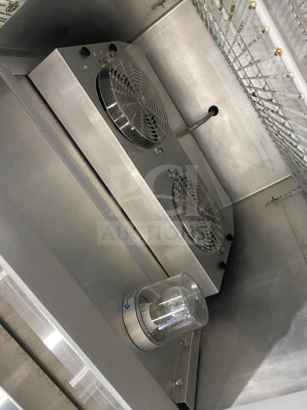 Continental 1RE-HD stainless steel refrigerator interior, showing fans and light, in good condition.